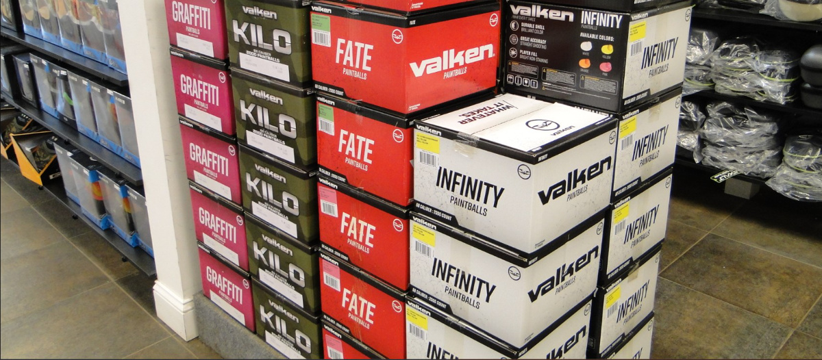 Older Valken paintball boxes displayed in a retail setting.